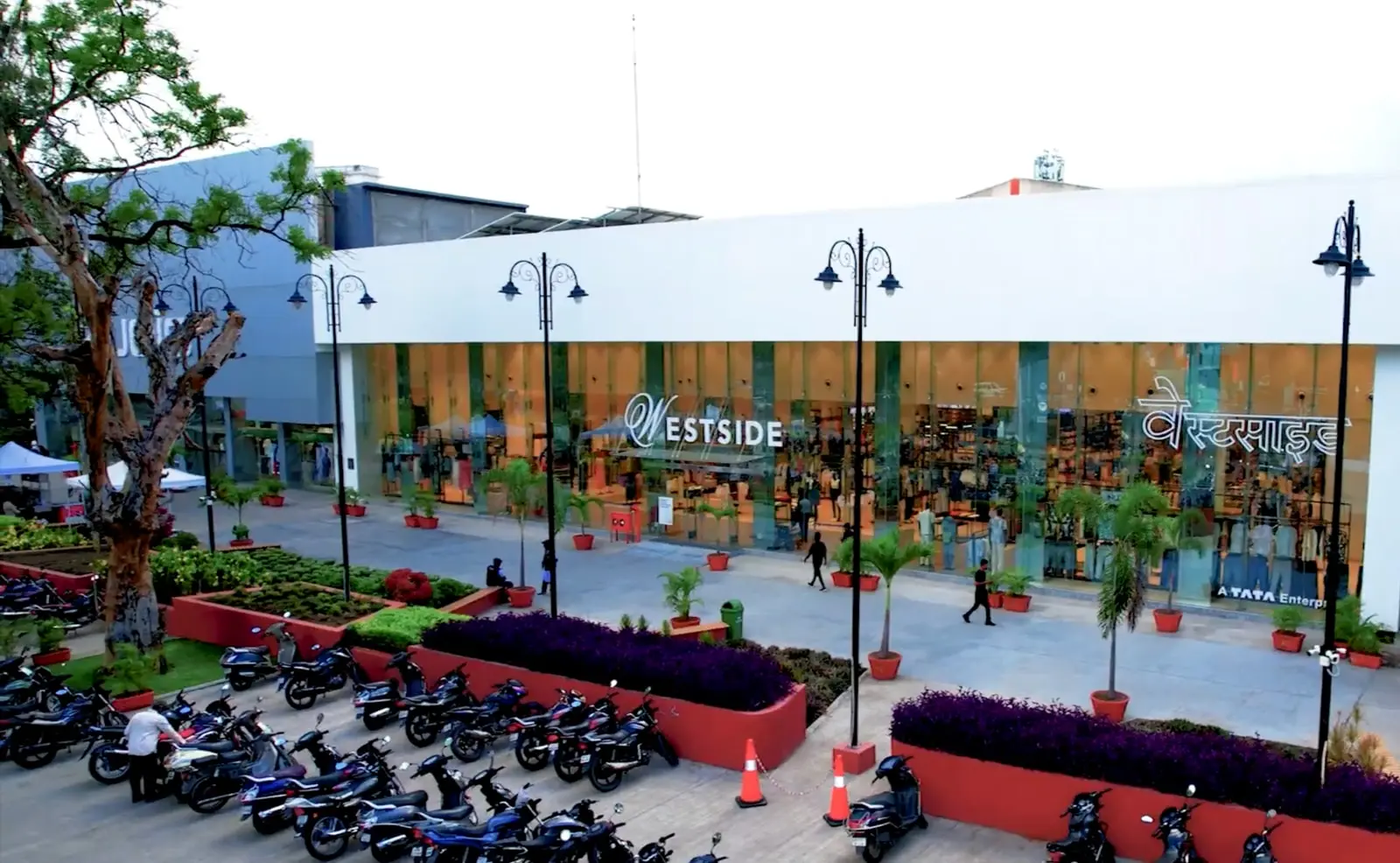 The operating Westside storefront and landscaped retail walk at Jamshri City